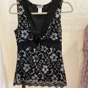 Cute black and sliver top. New without tags. Size medium.